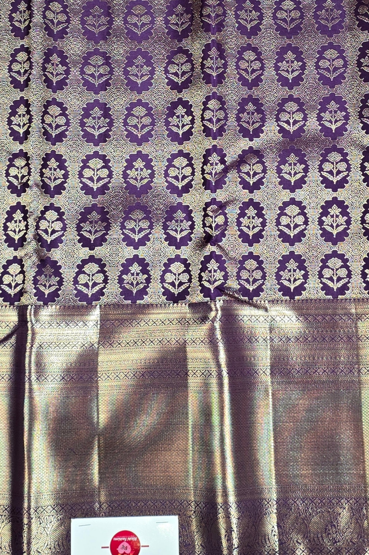 Textile with purple floral pattern on a neutral background