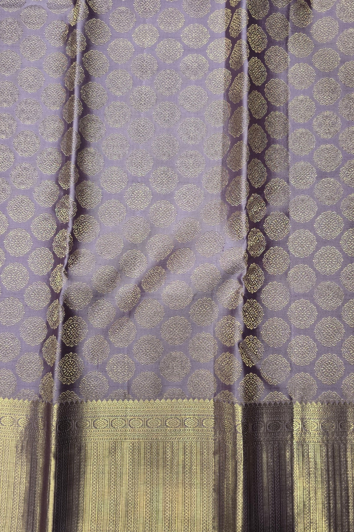Purple fabric with gold and black pattern