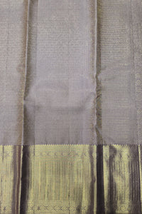 Close-up of a gray fabric with intricate patterns and designs.