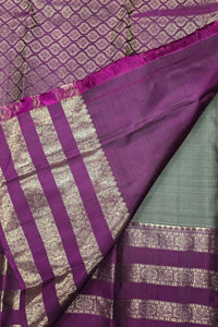 Purple fabric with intricate patterns and designs