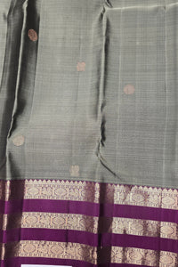 Gray saree with a purple border featuring intricate patterns