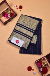 Decorative saree with intricate patterns on a beige background