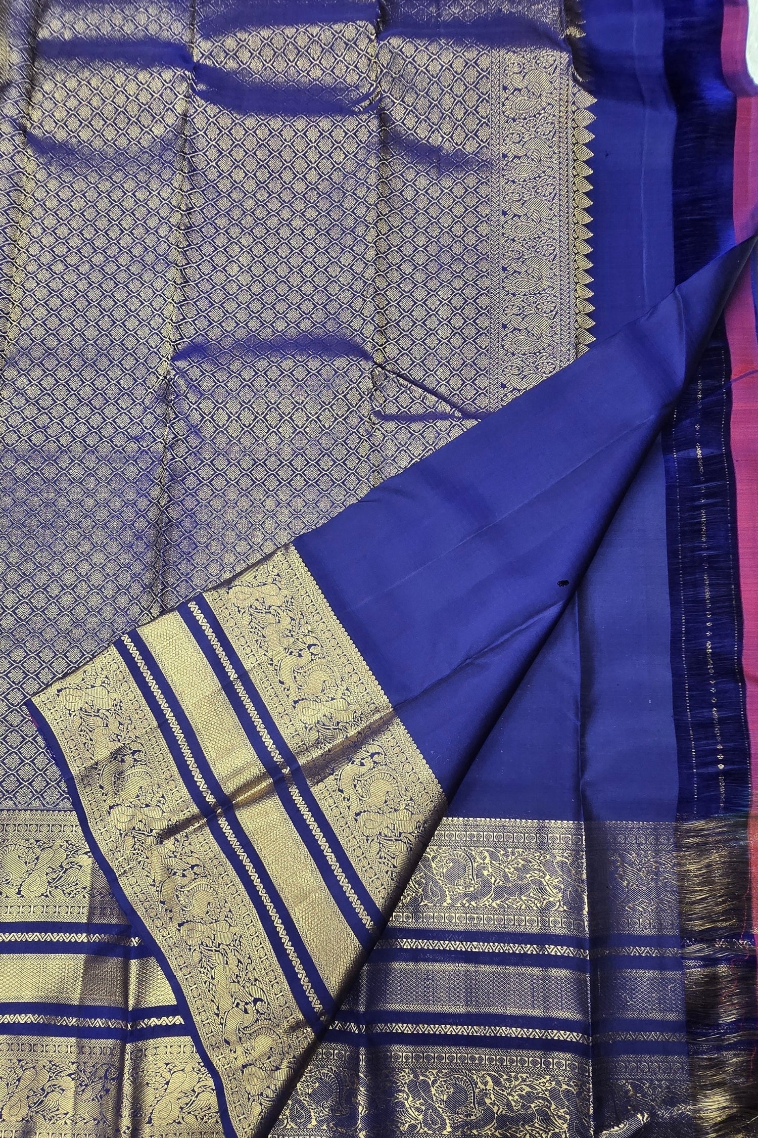 Blue and purple traditional fabric with intricate patterns