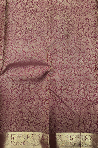 Close-up of a textured fabric with a floral pattern on a dark background