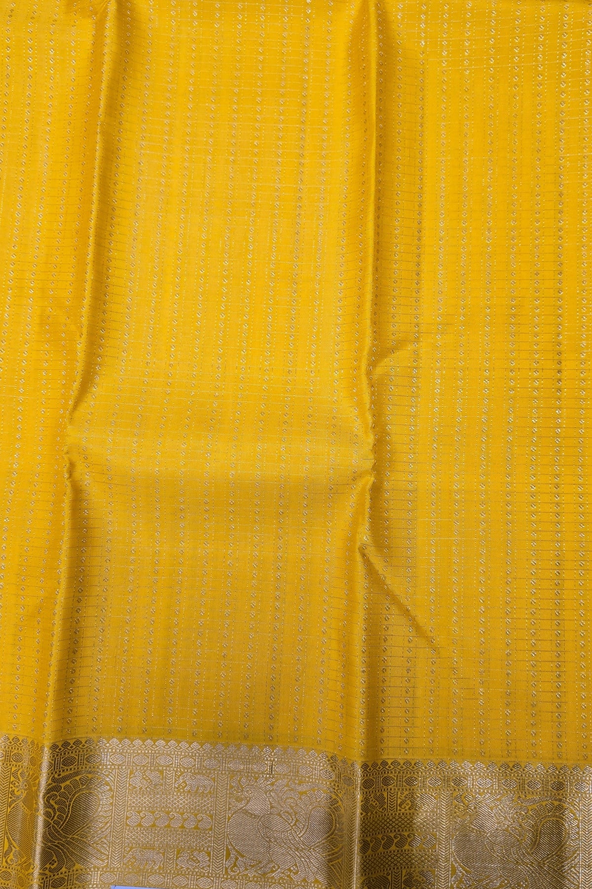 Yellow fabric with a subtle pattern and brown border