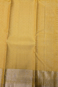Close-up of a yellow fabric with a subtle pattern
