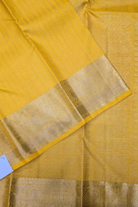Close-up of a yellow fabric with a gold border