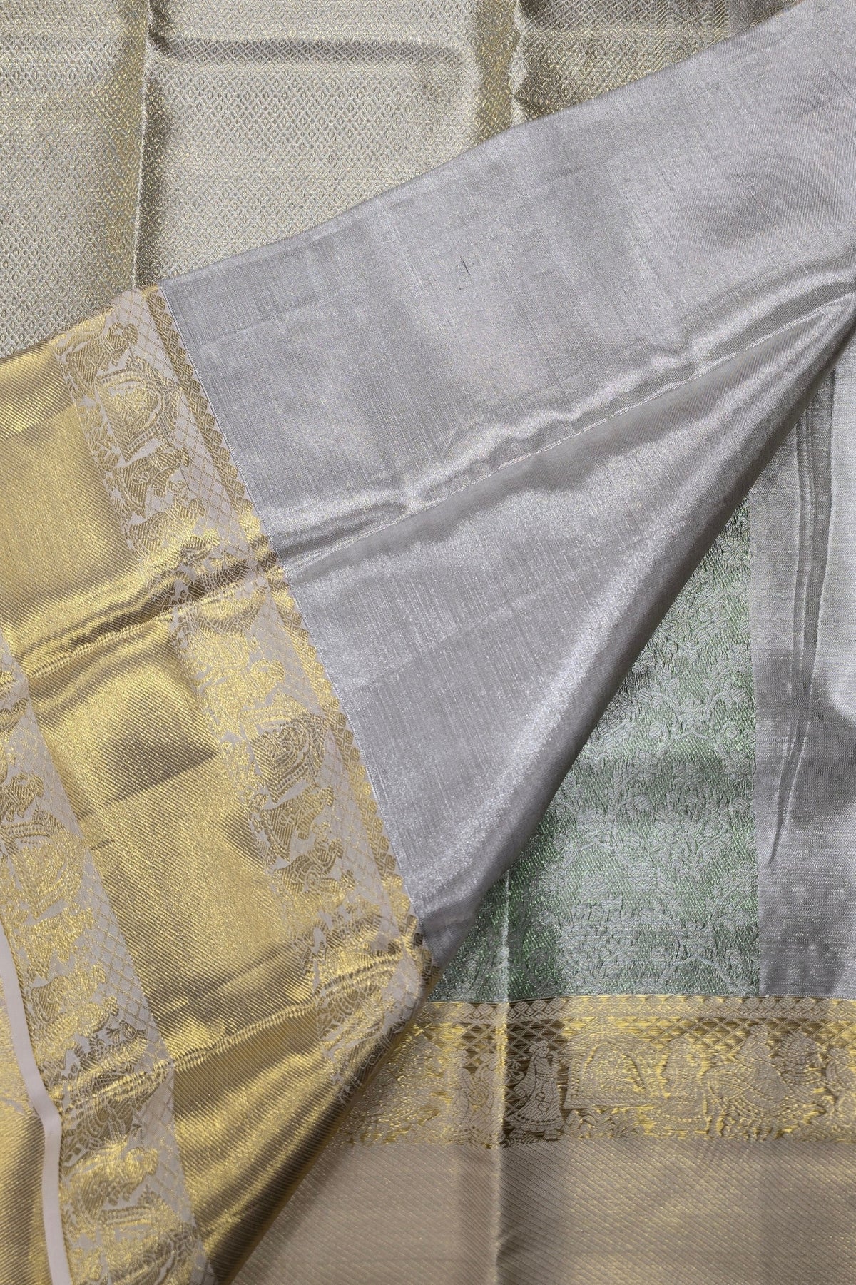 Close-up of a fabric with gold and gray patterns