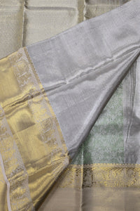 Close-up of a fabric with gold and gray patterns