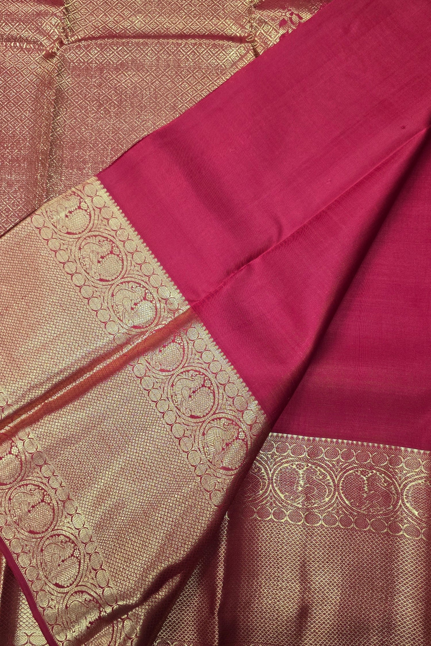 Saree with pink and gold patterned border
