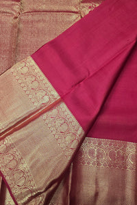 Saree with pink and gold patterned border