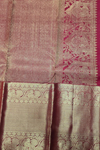 Close-up of a pink and beige fabric with intricate patterns