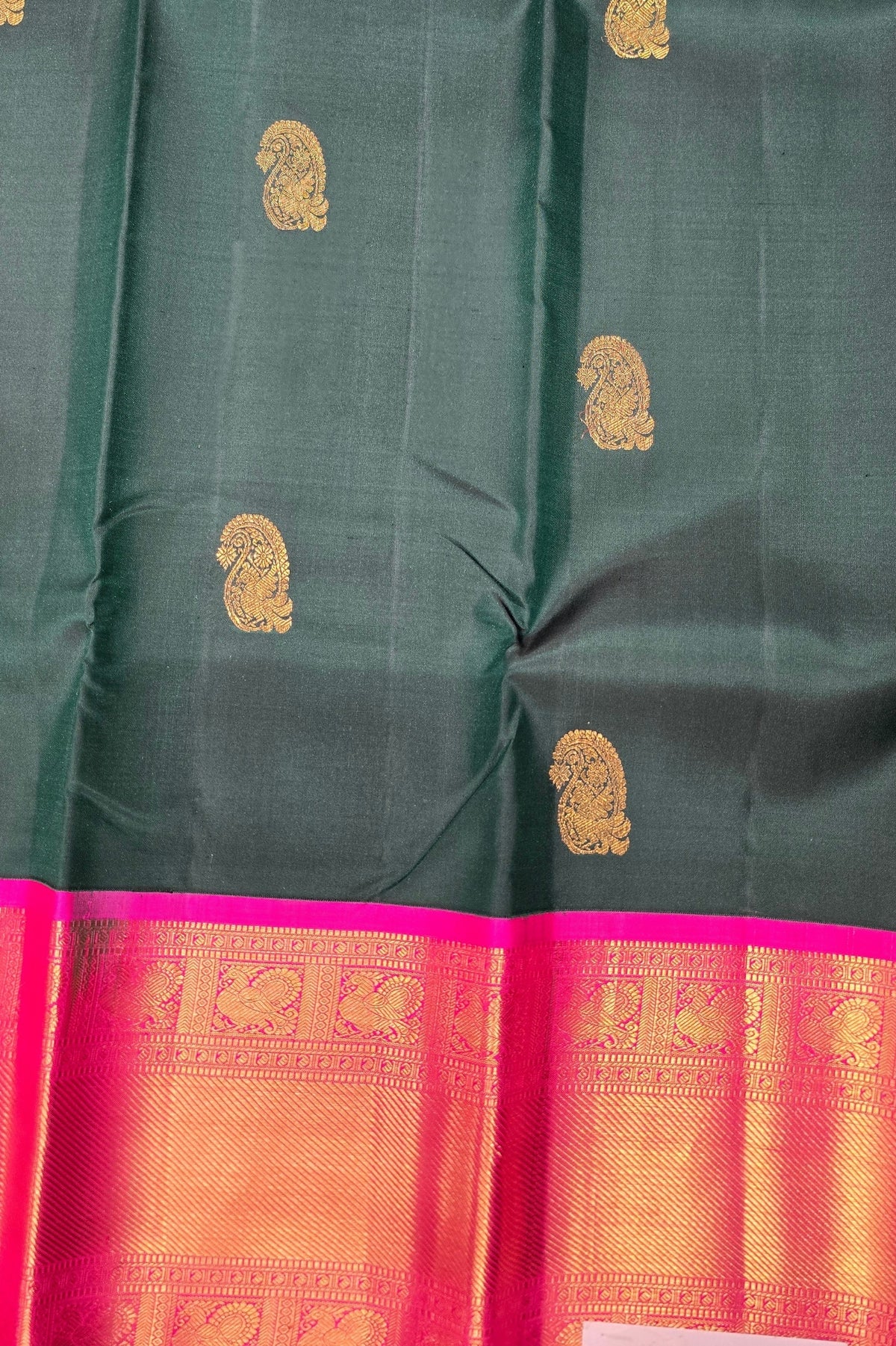 Green saree with gold and pink border