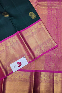 Traditional saree with intricate patterns and a brand card in the foreground