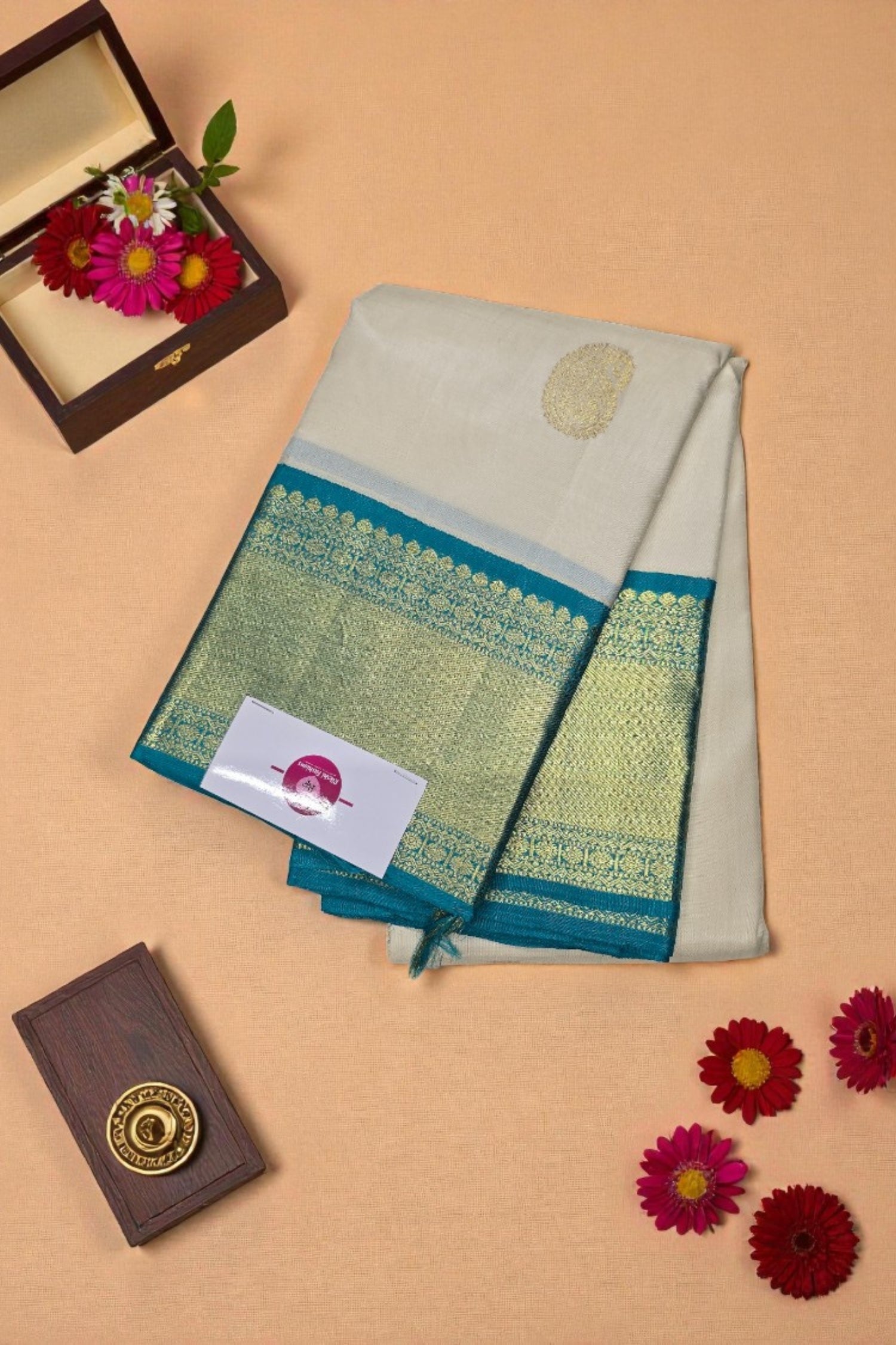 Traditional saree with a decorative border on a beige background