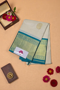 Traditional saree with a decorative border on a beige background