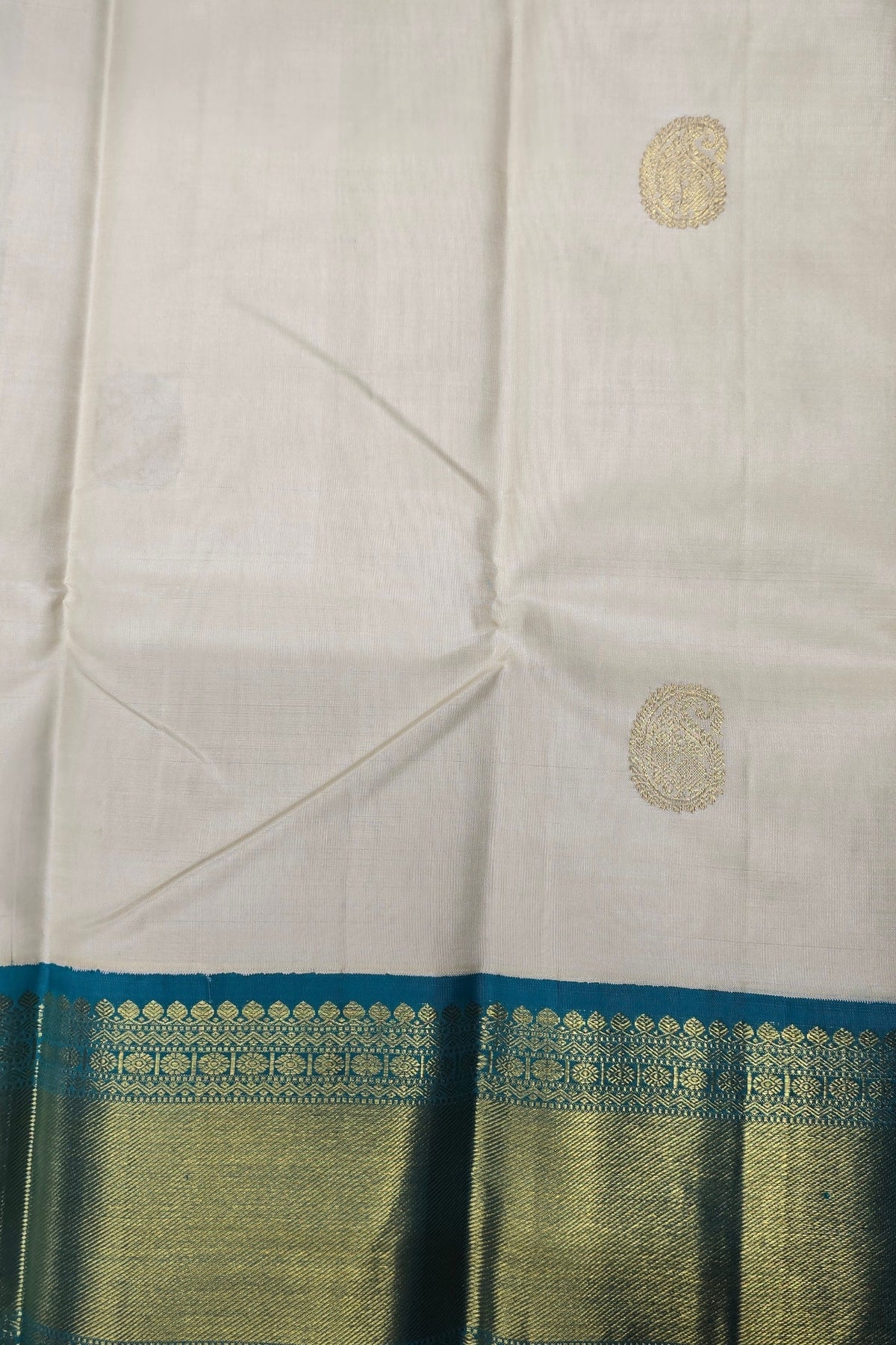 White fabric with gold and blue border