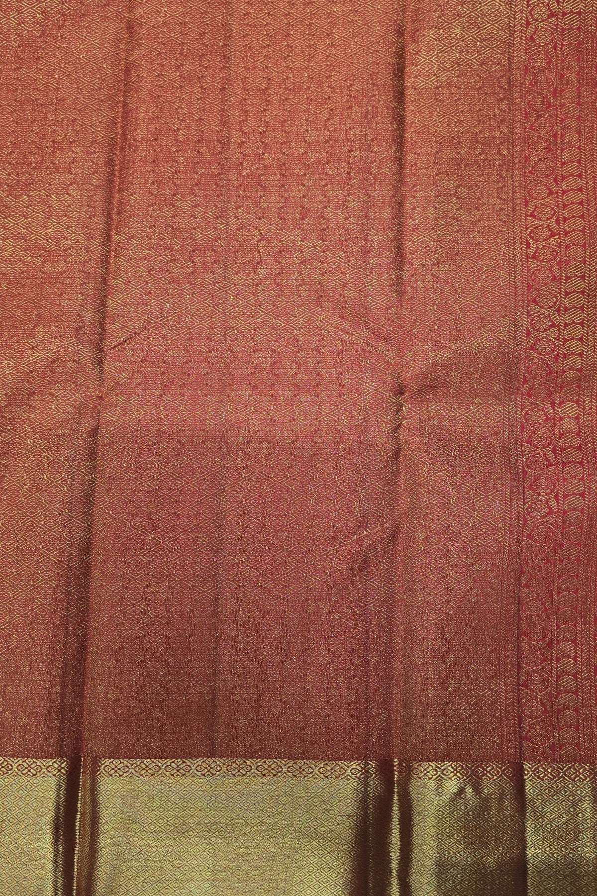 Close-up of a patterned fabric with a focus on texture and color gradient.