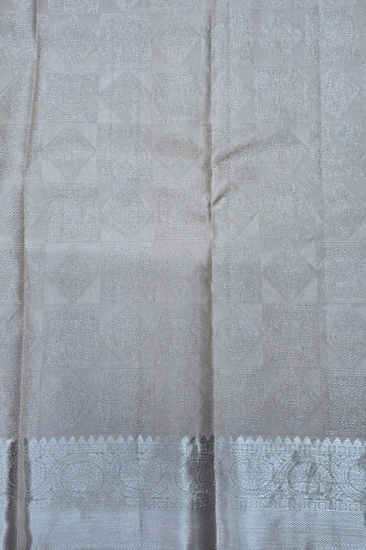 Close-up of a gray fabric with a subtle pattern