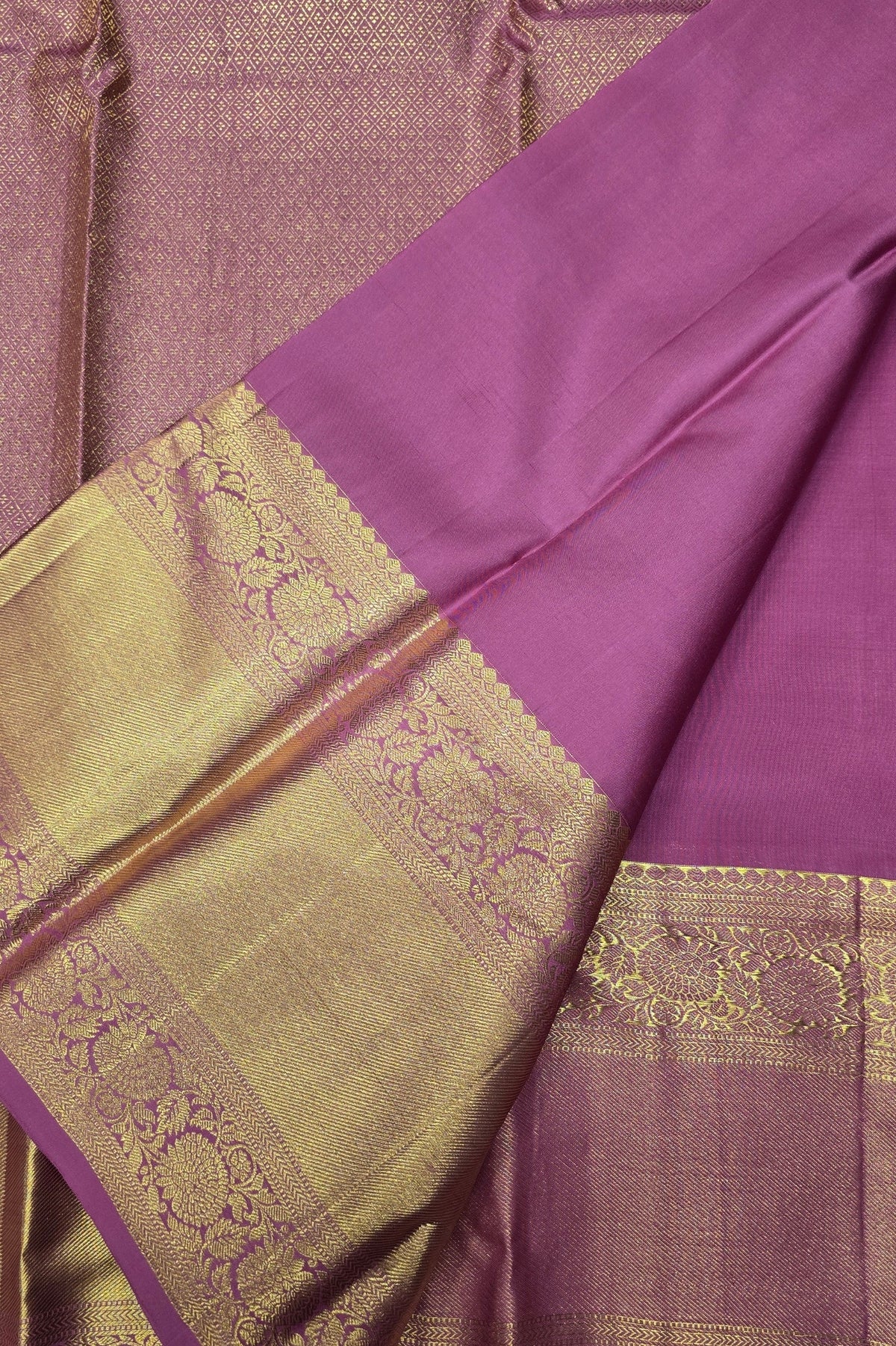 Purple saree with gold border and patterns