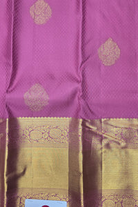 Purple fabric with gold patterns and a checkered border