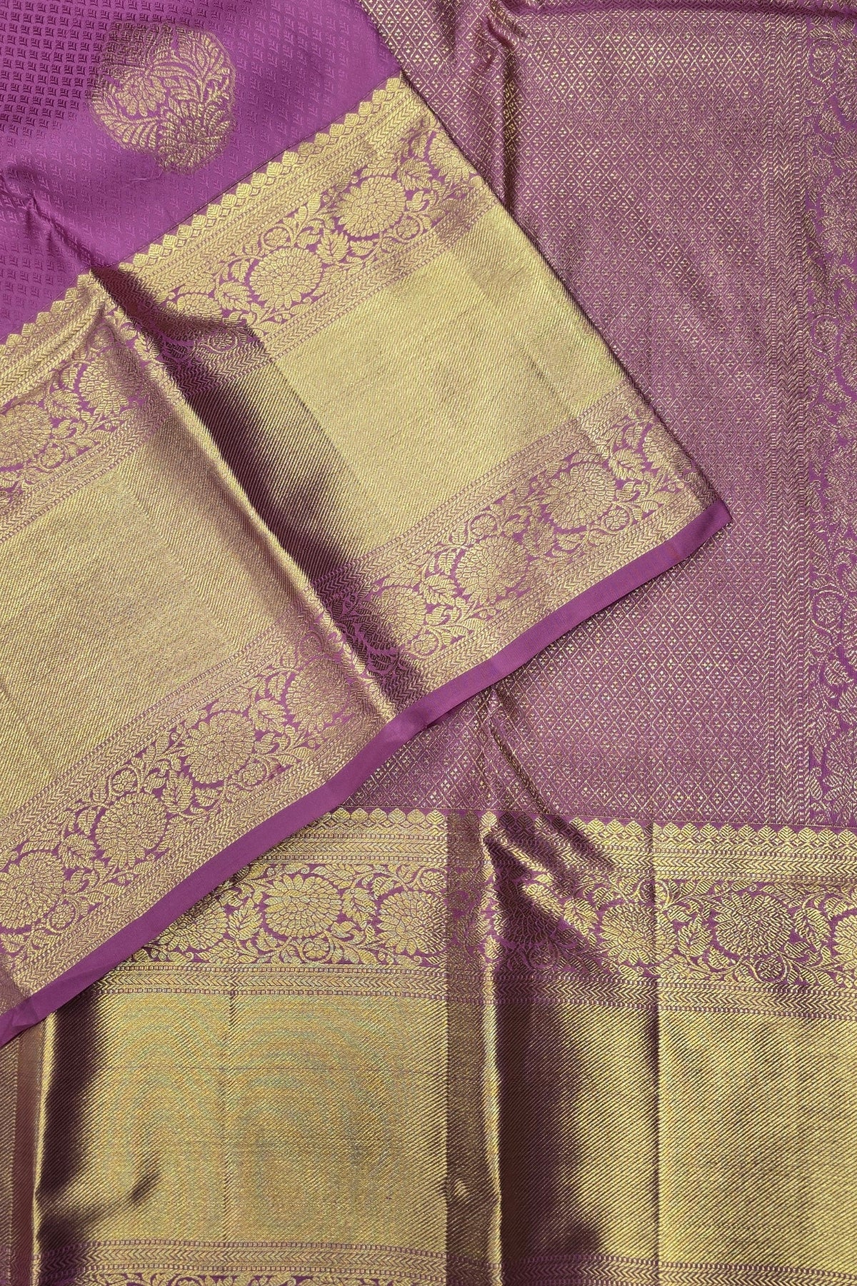 Purple and green saree with intricate patterns