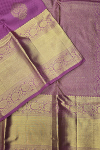 Purple and green saree with intricate patterns