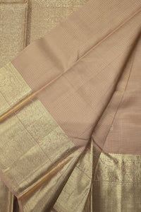 Close-up of a brown fabric with a textured pattern on a matching background