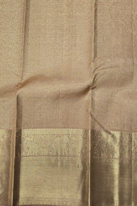 Close-up of a brown fabric with intricate patterns and embroidery.
