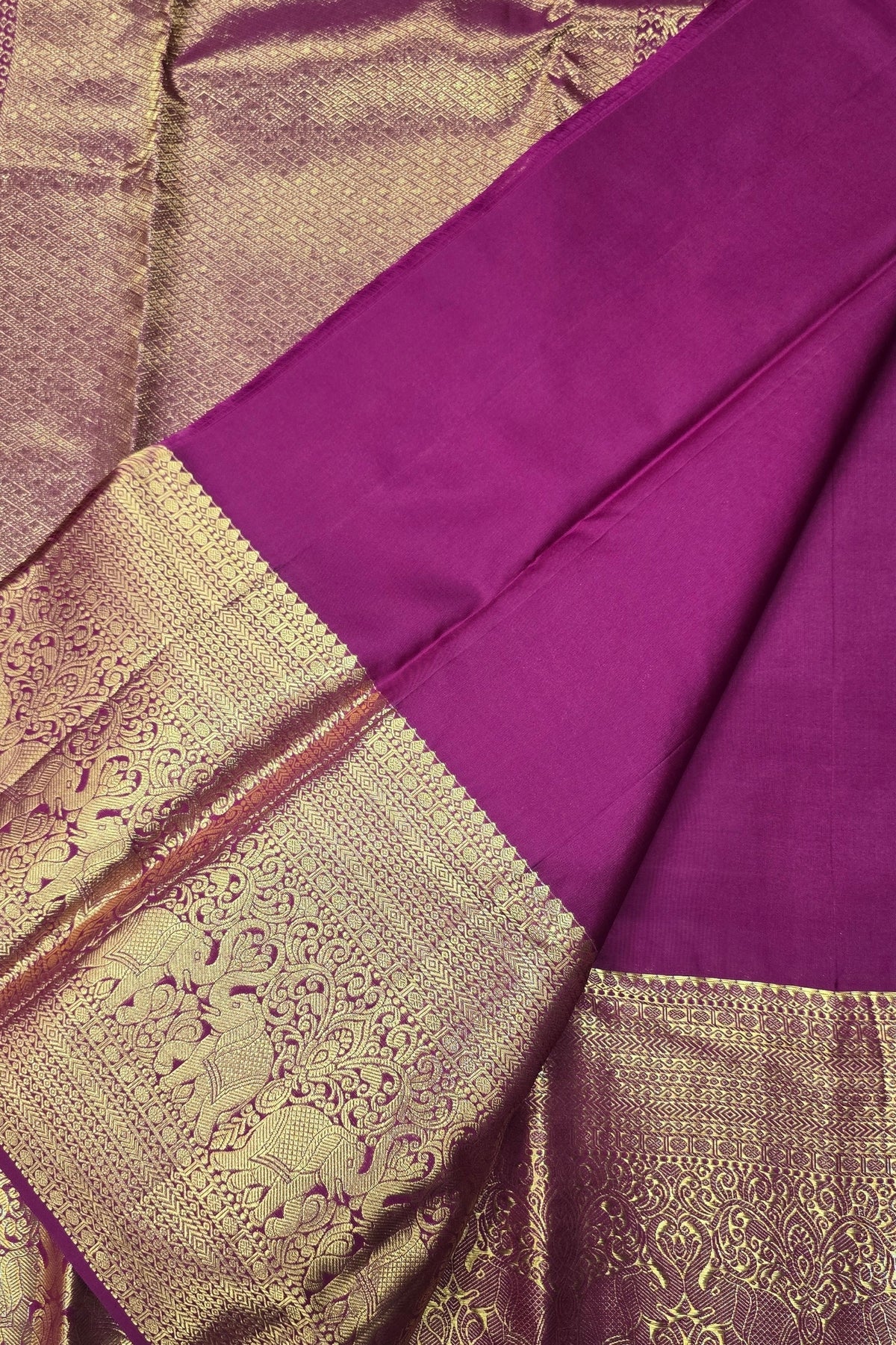 Purple fabric with gold border and intricate patterns