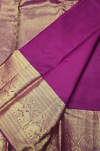 Purple fabric with gold border and intricate patterns