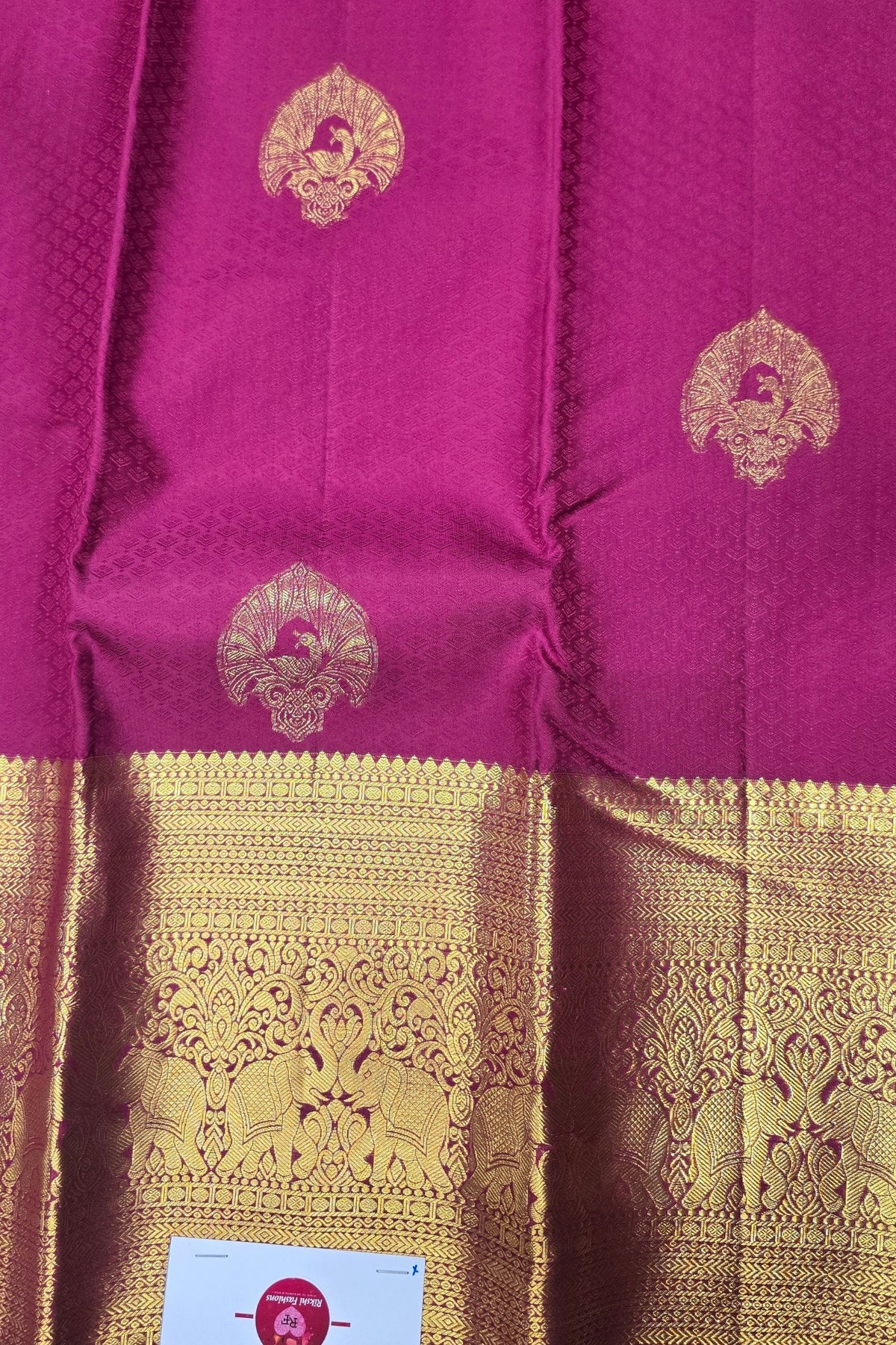 Purple fabric with gold embroidery and border