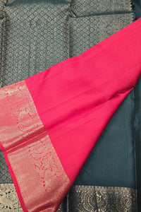Red fabric with intricate patterns on a textured background