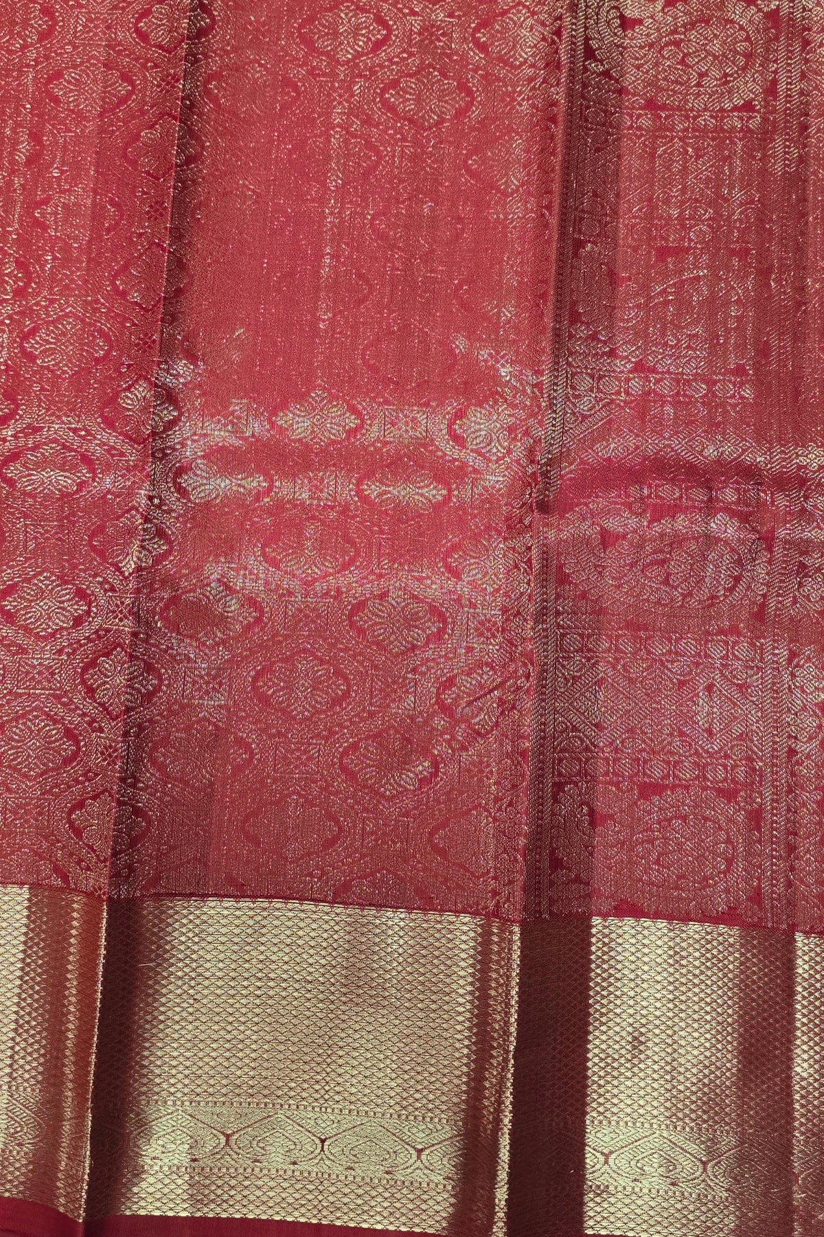 Close-up of a red and gold patterned fabric