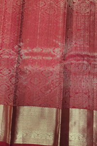 Close-up of a red and gold patterned fabric