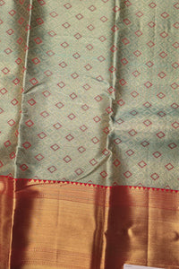 Fabric with a geometric pattern and a brown border