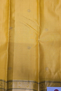 Yellow Kanchipuram Silk Saree with Grey Pallu – Bright & Graceful