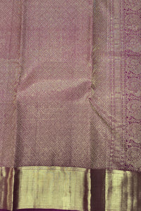 Purple fabric with intricate patterns and a green border