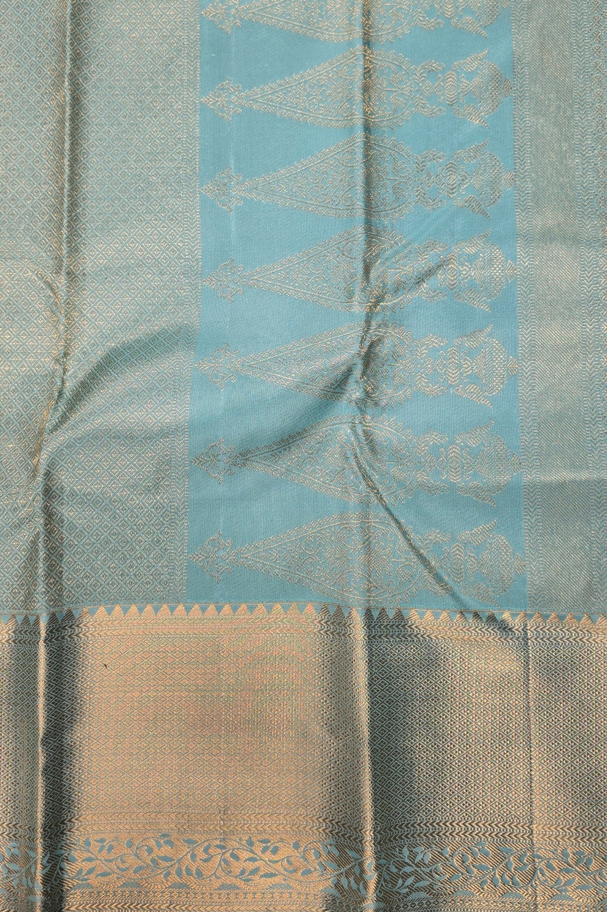 Close-up of a fabric with a blue and beige pattern