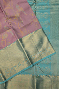 Traditional saree with a pink and green pattern on a blue background