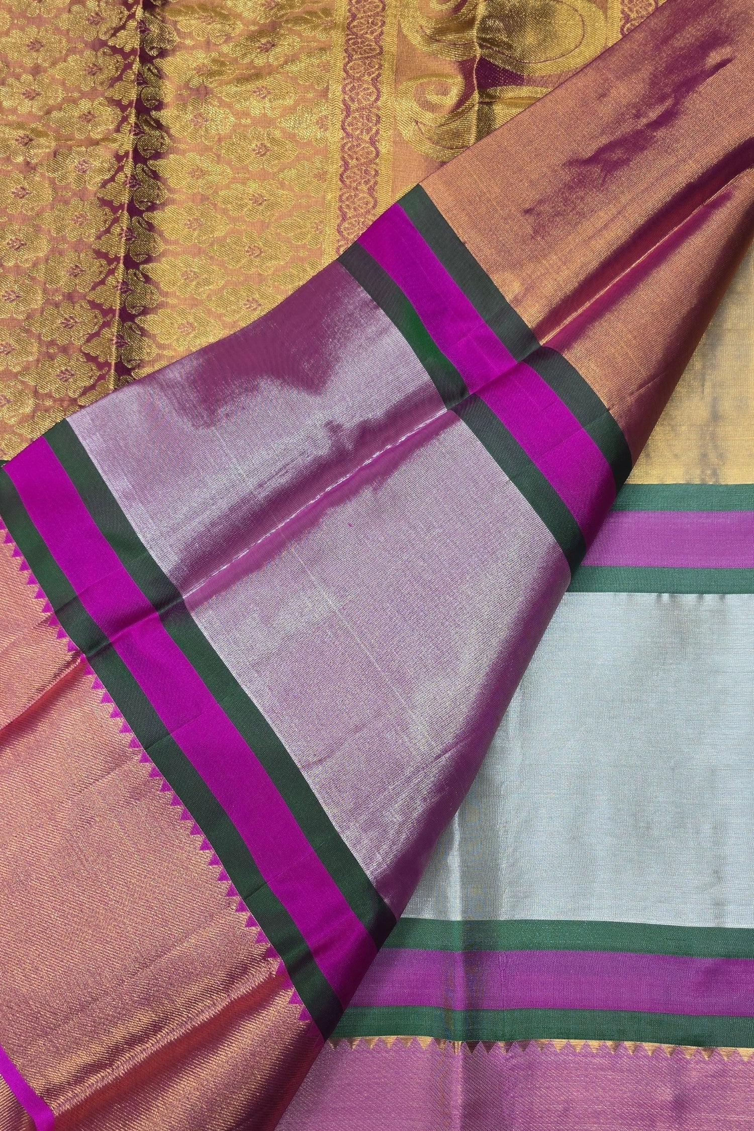Saree with pink and purple border on a gold background