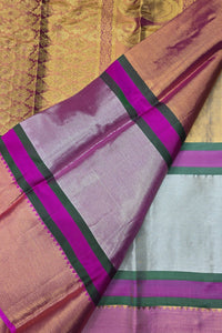 Saree with pink and purple border on a gold background