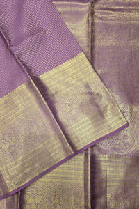 Purple and gold saree with intricate patterns