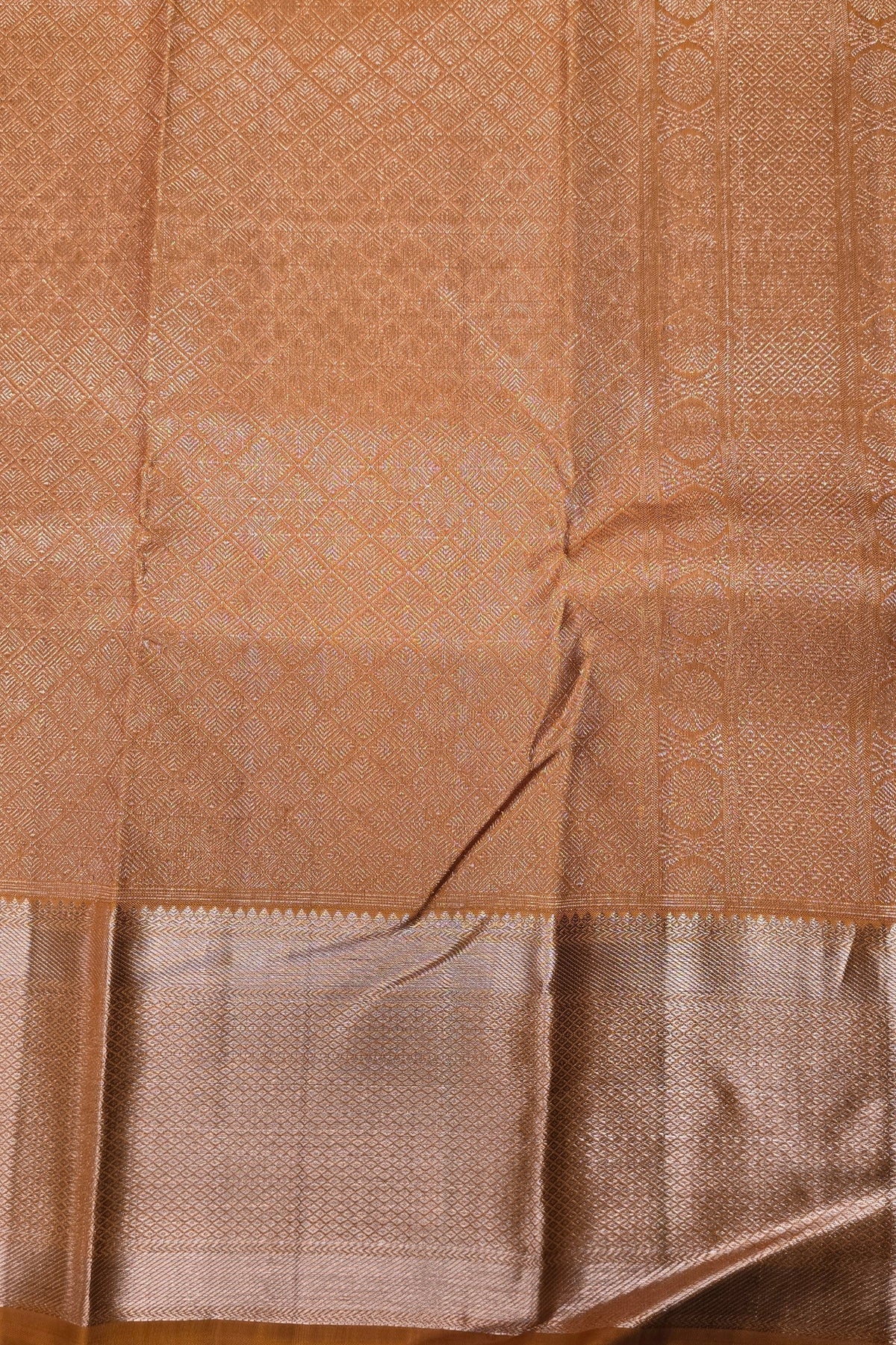 Close-up of a brown fabric with intricate patterns
