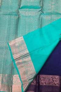 Teal and purple fabric with a woven pattern