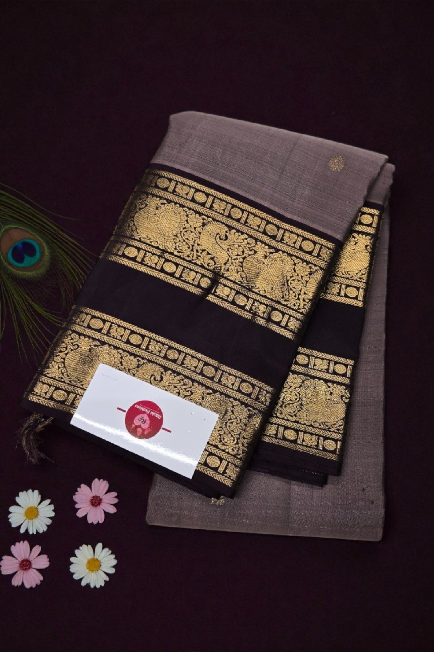 Two brown fabric items with gold patterns on a dark background