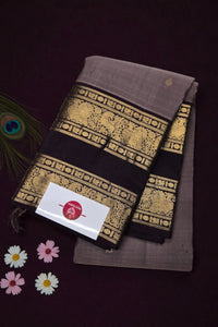 Two brown fabric items with gold patterns on a dark background