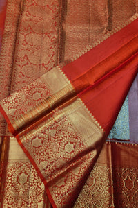 Red and gold patterned fabric with intricate designs
