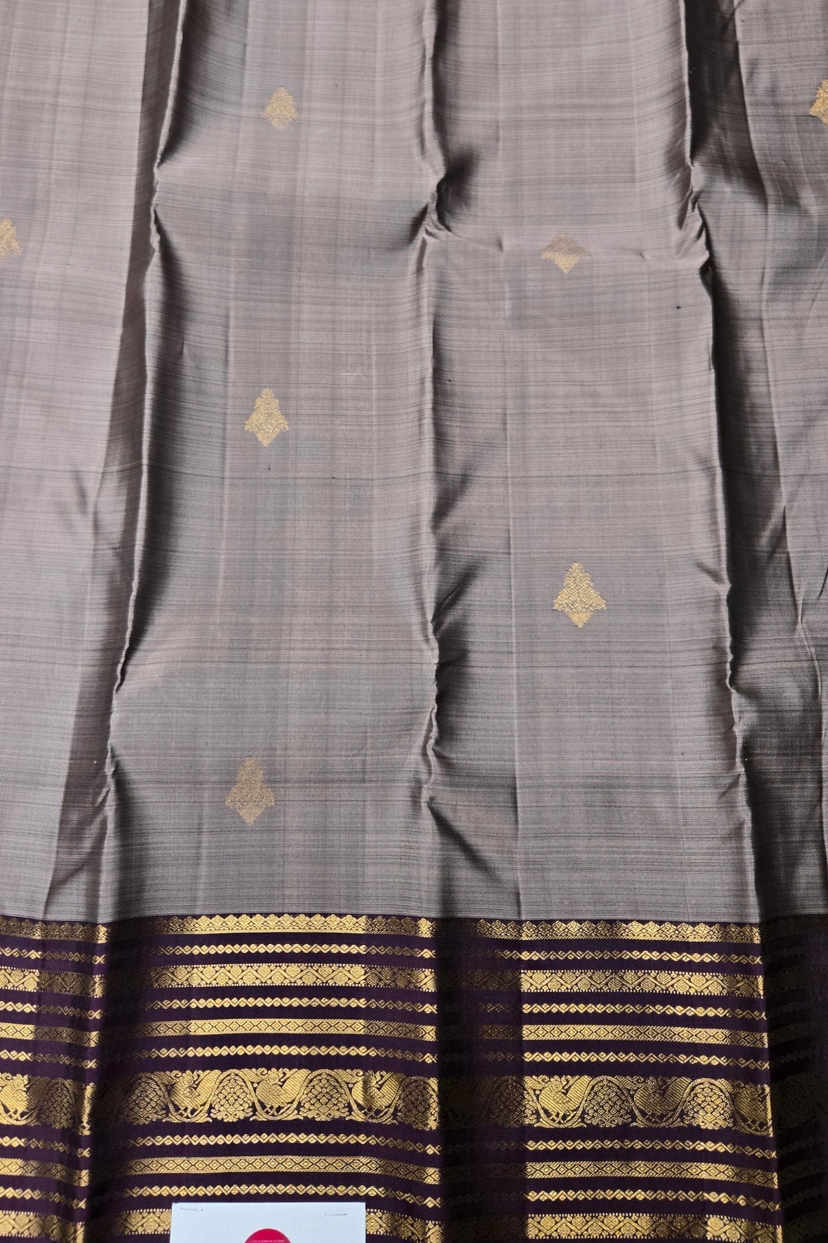 Gray saree with gold and black border