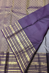 Purple fabric with gold patterns on a textured background
